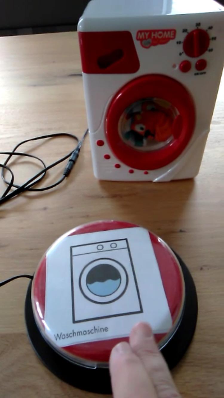 Taster und Waschmaschine